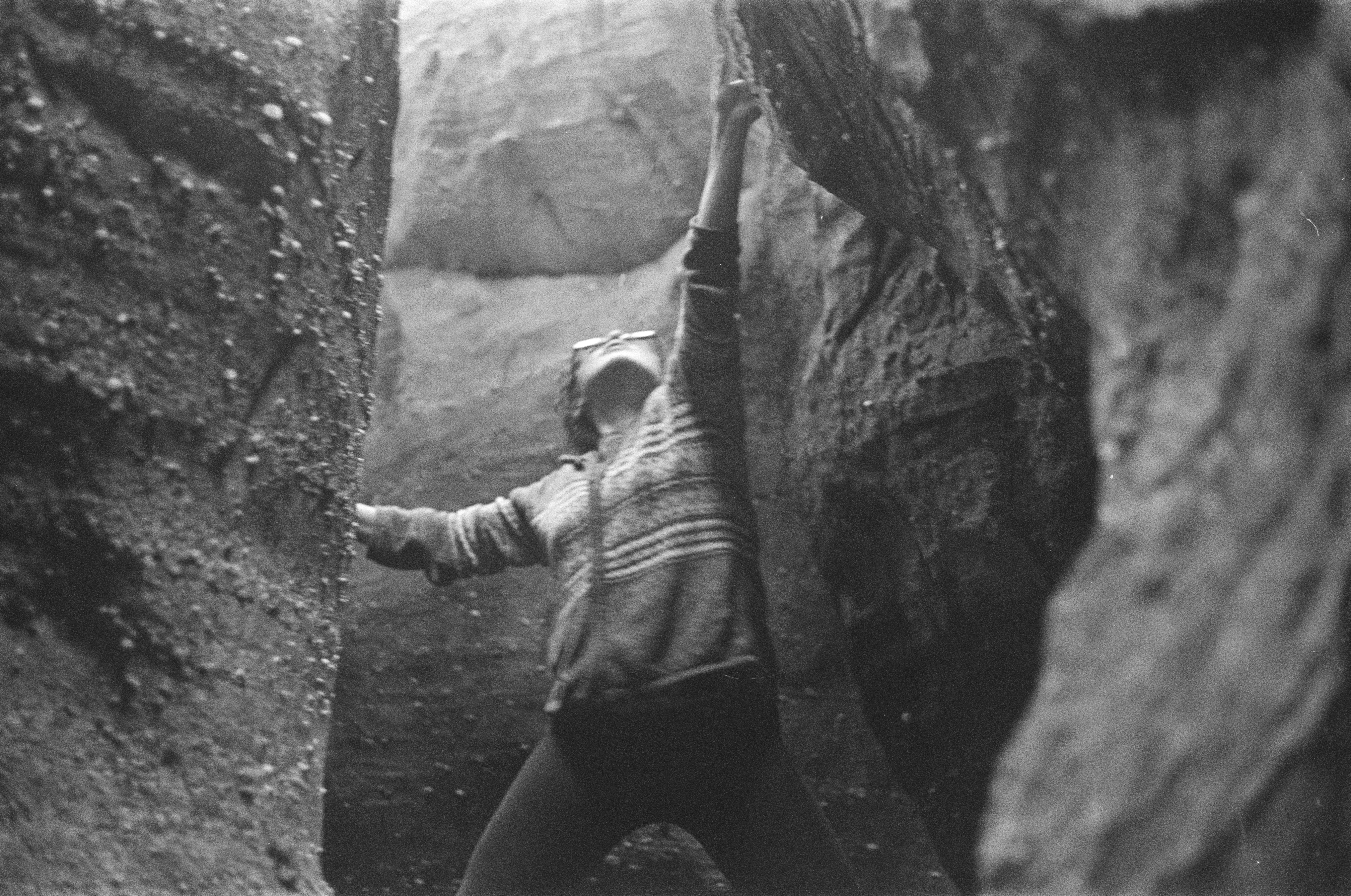 girl climbing in cave
